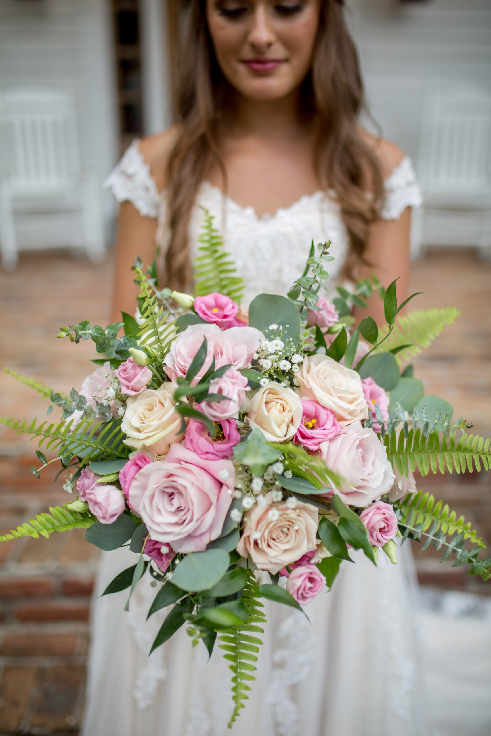 Bride carrying exquisite floral arrangements for her bridal bouquet
